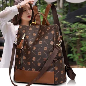 Retro brown large capacity backpack with floral pattern and leather splicing accents