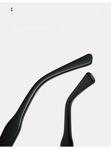 Detail shot of curved mirror legs on black glossy frames with a smooth finish
