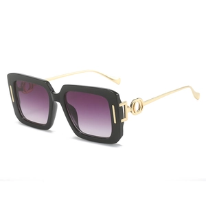 Square black frame sunglasses with purple gradient lenses and gold hollow metal temples
