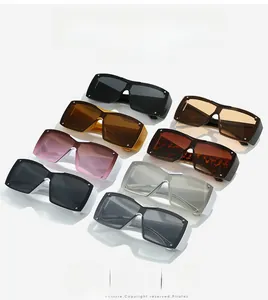 Detailed close-up showing various colors of large square Y2K sunglasses with silver rivets