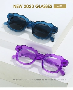 Close-up of stylish wavy frame sunglasses in blue and purple on a white display