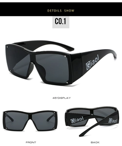 Detail shot of black Y2K oversized sunglasses featuring silver rivets and white side logo