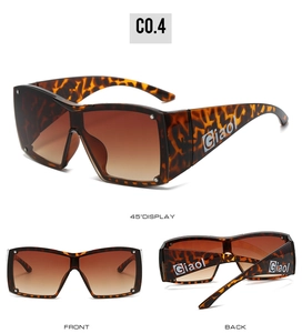 Detail view of oversized Y2K shield sunglasses in tortoiseshell frame with gradient lenses