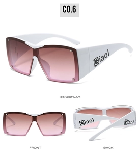 Detail view of white oversized Y2K sunglasses with pink gradient lenses and silver rivets