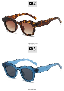 Detail view of wavy frame sunglasses in tortoise shell and transparent blue finishes
