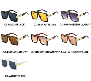 Detail of square oversized sunglasses collection with gold infinity hardware on temples