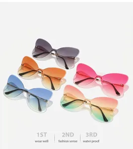 Macro detail of frameless butterfly sunglasses showing five gradient lens color options