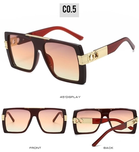 Detail view of square sunglasses featuring bold frame and golden metal temple accents