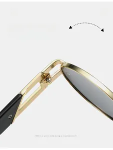 Détail macro de la charnière en métal doré sur des lunettes de soleil ovales rétro