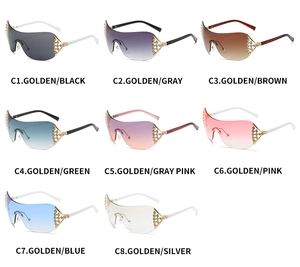 Detail view of eight Y2K oversized rimless sunglasses with rhinestone metal temples