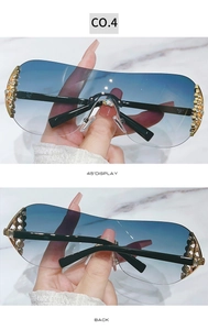 Detail view of Y2K rimless sunglasses with blue gradient lenses and rhinestone accents