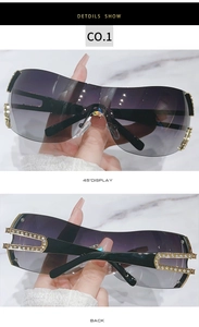 Detail view of purple gradient oversized sunglasses with rhinestone studded hollow temples