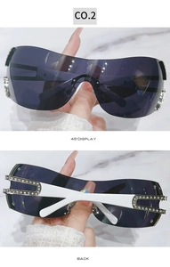Detail view of Y2K shield sunglasses with rhinestone temples and 45-degree angle display