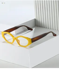 Detail of trendy polygonal glasses frames in bright yellow and dark tortoiseshell finish