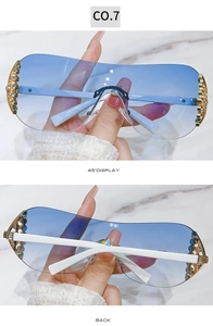 Detailed close-up showing rhinestone hinge accents and blue gradient lenses of Y2K sunglasses