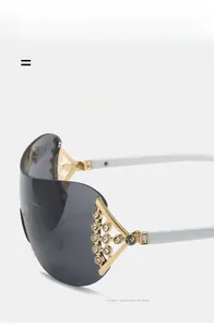 Detail of Y2K rimless sunglasses featuring crystal rhinestones on white temples