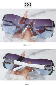 Detail view of Y2K rimless sunglasses with purple gradient lenses and rhinestone temples