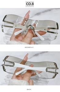 Detailed view of Y2K rimless sunglasses with hollowed rhinestone temples and grey lenses