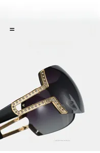 Detail of oversized rimless sunglasses featuring gold hollow temples with sparkling rhinestones