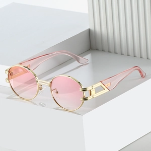 Lunettes de soleil ovales rétro avec verres dégradés roses et monture en métal doré chic
