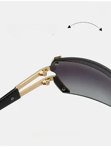 Detail of durable gold metal hinge on fashion sunglasses with gradient grey lenses