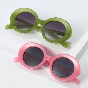 Retro oval sunglasses in translucent olive green and pink frames with gradient lenses