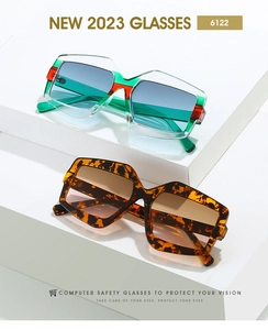 Detail of geometric oversized sunglasses in gradient green and tortoiseshell acetate frames