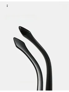 Detail of curved eyeglass legs with arc design for comfortable wear and glossy finish