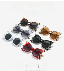 Cat eye sunglasses with star patterns and rhinestones in six colors on white background