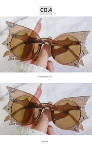 Detail view of butterfly cat eye sunglasses with rhinestones and star accents