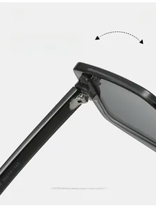 Macro view showing the durable metal hinge and size parameters of black geometric sunglasses