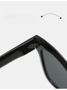 Détails des charnières métalliques durables sur les lunettes de soleil œil-de-chat