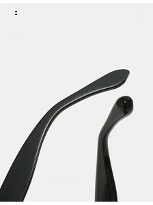 Détail des branches incurvées sur lunettes de soleil œil de chat noires pour un confort optimal