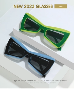 Détails de lunettes de soleil œil-de-chat géométriques en vert et bleu, finition brillante