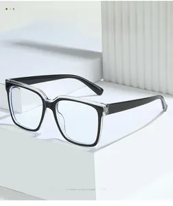 Detail of square TR anti-blue light glasses with black and clear two-tone contrast frame