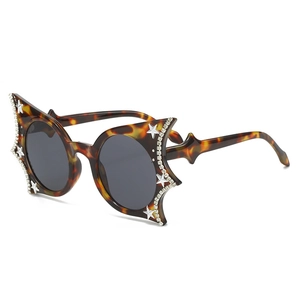 Unique tortoise star-shaped sunglasses with sparkling rhinestones and grey lenses