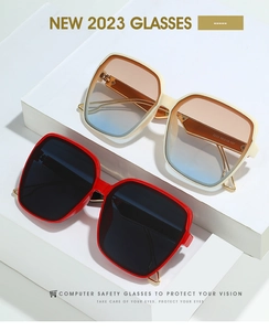 Detail view of square gradient sunglasses on modern white blocks showing size code
