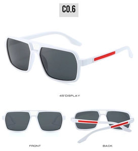 Detail view of white square frame sunglasses with grey lenses and red temple accents