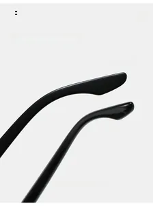 Detail of ergonomic curved mirror legs on polished black polarized men's sunglasses