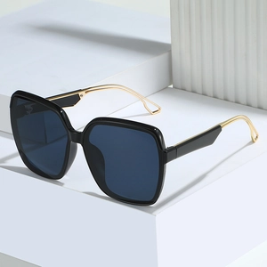 Chic oversized square sunglasses with black gradient lenses and elegant gold metal temples