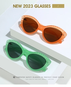Detailed view of cat-eye eyewear frames with textured stud accents on top