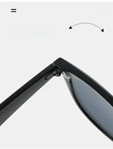 Detail of durable texture metal hinge on black oversized fashion sunglasses