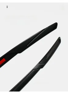 Macro shot of curved black sport sunglasses temples with comfortable red accents