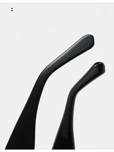 Detail of curved black mirror legs on cat-eye sunglasses for a comfortable fit