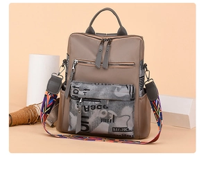 Detail of khaki oxford fabric backpack with stylish colorful geometric shoulder strap