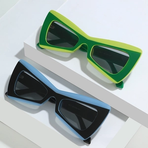 Lunettes de soleil bat-wing hip-hop en vert et bleu avec monture œil de chat stylée