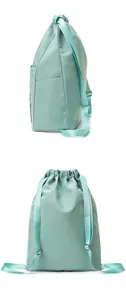 Detailed side and back views of a mint green waterproof Oxford fabric drawstring backpack