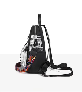 Side view of oxford backpack showing metal zipper and colorful geometric strap