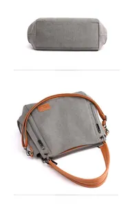 Detail view of grey canvas tote bag base and side zippers with brown handles