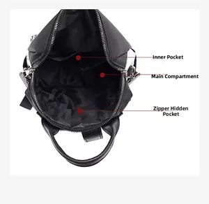 Internal view of the black nylon backpack showing main pocket and zipper compartments